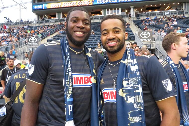 Eric Paschall (left) and Phil Booth were among the Villanova basketball players honored before the Union’s game with Chicago.