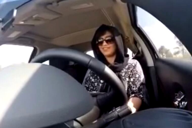 This Nov. 30, 2014 image made from video released by Loujain al-Hathloul, shows her driving towards the United Arab Emirates - Saudi Arabia border before her arrest on Dec. 1, 2014, in Saudi Arabia. Rights activists say at least six people who have campaigned for human rights in Saudi Arabia, including four women, al-Hathloul among them, who pushed for the right to drive.
