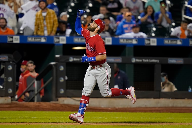 Philadelphia Phillies' Bryce Harper gestures as he approaches home plate after hitting a home run during the sixth inning of the second game of a doubleheader against the New York Mets Friday, June 25, 2021.