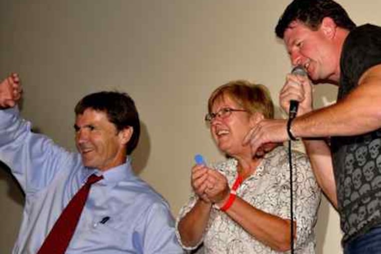 Bob and Helena McElhenney, parents of "It's Always Sunny in Philadelphia" star Rob McElhenney, with WMMR's Preston Elliot (right) at a "Sunny" viewing party Tuesday at the Troc. Season 6 premieres Thursday on FX.