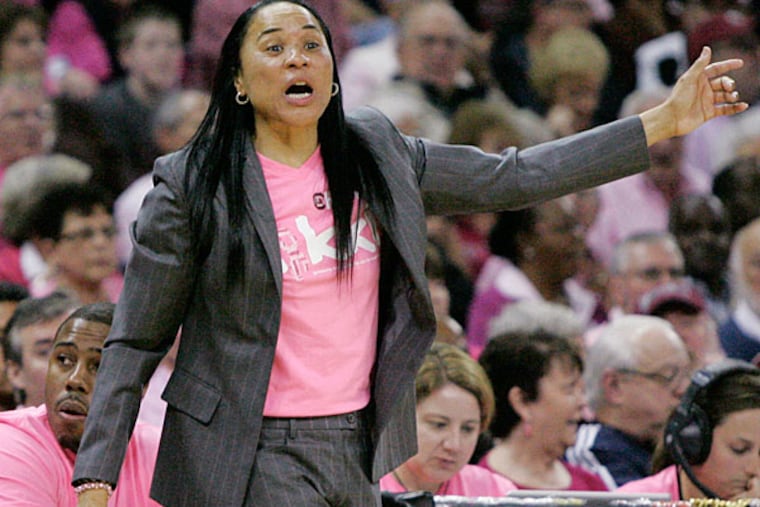South Carolina's Dawn Staley talks to her players during the second half of their NCAA college basketball game against Florida, Sunday Feb. 23, 2014, in Columbia, SC. South Carolina defeated Florida 69-55. (Mary Ann Chastain/AP)
