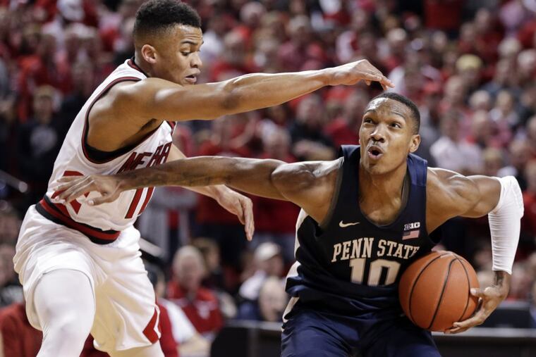 Penn State's Tony Carr (10) driving to the basket against Nebraska's Evan Taylor (11) on Sunday. Carr played his high school ball for Roman Catholic.