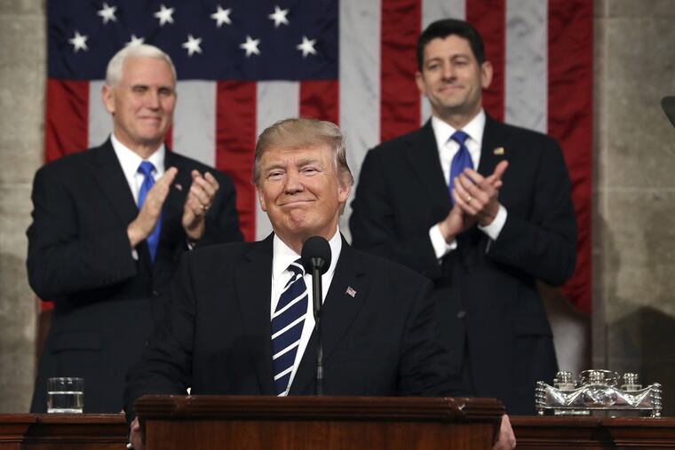 Vice President Mike Pence (L) and Speaker of the House Paul Ryan (R) applaud as US President Donald J. Trump (C) arrives to deliver his first address to a joint session of Congress from the floor of the House of Representatives in 2017. Traditionally, the first address to a joint session of Congress by a newly-elected president is not referred to as a State of the Union.
