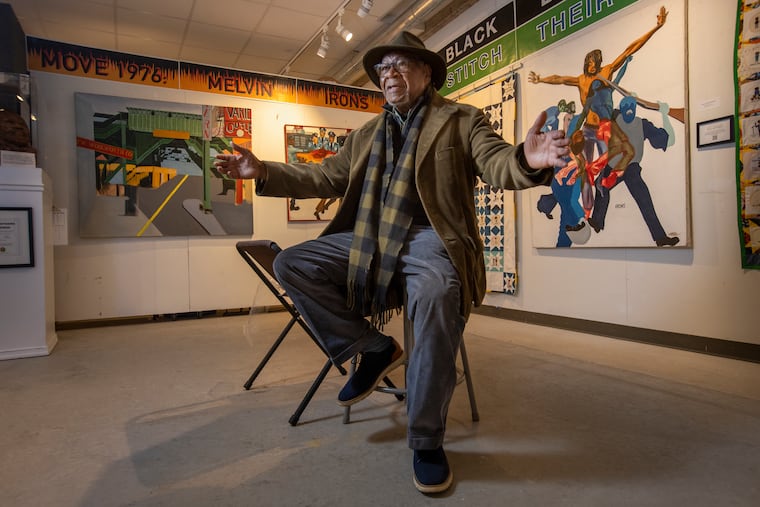 Ralph Hunter Sr., founder of Atlantic City's African American Heritage Museum of Southern New Jersey, discusses the work of artist Melvin C. Irons Sr., whose paintings depicting police violence against MOVE members.