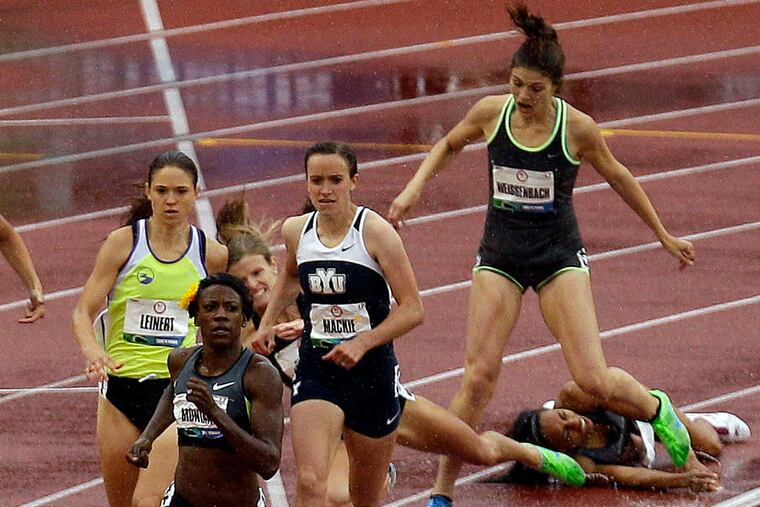 Former West Catholic and LSU runner Latavia Thomas (right) falls during a women's 800-meter prelim at the U.S. Olympic track and field trials in Eugene, Ore. MARCIO JOSE SANCHEZ / Associated Press