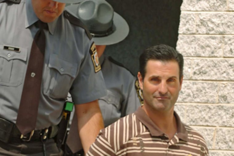 Louis Monacello with Pa. state troopers before a scheduled arraignment in 2008. (Clem Murray / Staff Photographer)