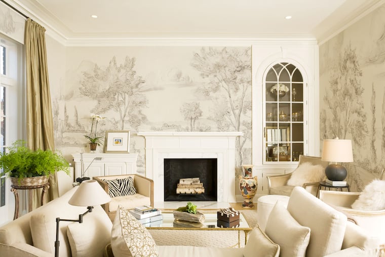 “People embrace things that feel handmade and have a link to the past,” says Susan Harter, who makes hand-painted scenic wallpaper in her Port Townsend, Washington, studio. Shown here is her Delft pattern.