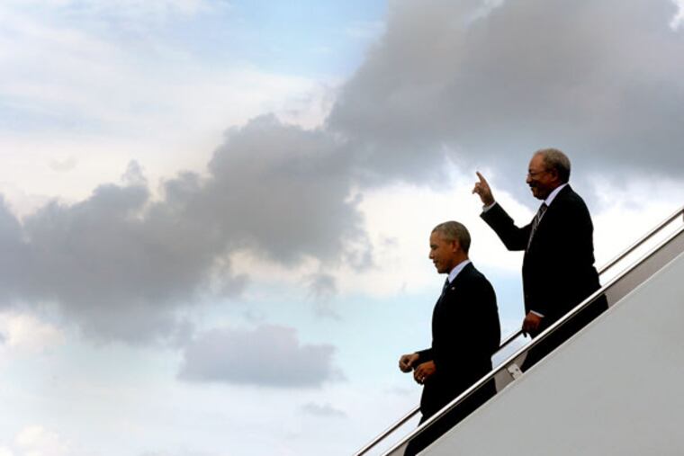 President Barack Obama arrives with Congressman Chaka Fattah (right) at Philadelphia International Airport July 14, 2015. (TOM GRALISH / Staff Photographer)