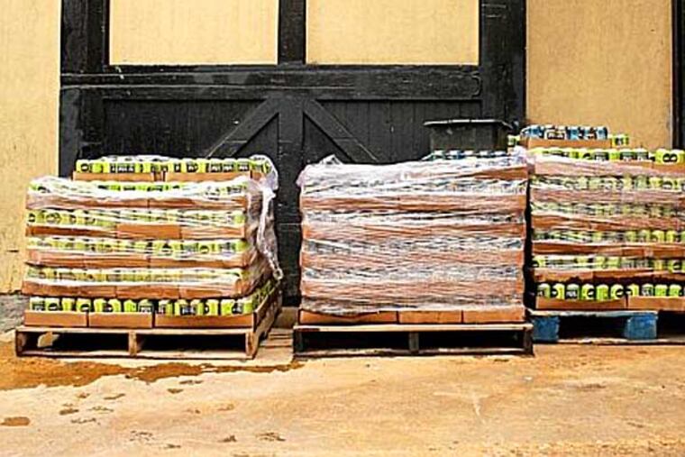 Hundreds of cases of beer were ruined at the The Manayunk Brewing Company after last week's rain which flooded the area, in Manayunk, PA on Friday, May 9, 2014. ( COURTNEY MARABELLA / Staff Photographer )