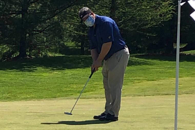 Marcus Hayes putts at Talamore Country Club.