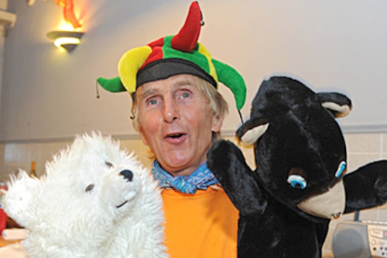Rocky Wilson with fuzzy friends at the Pizza and Poetry night. CLEM MURRAY / Staff Photographer