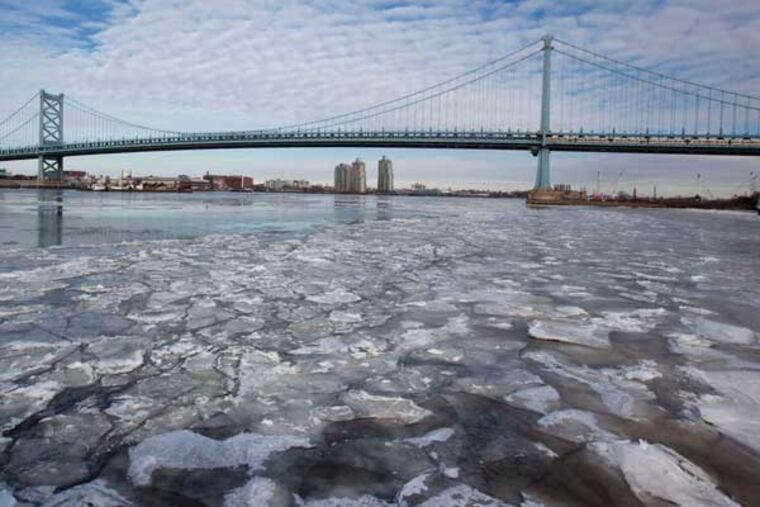 Ice on the Delaware near Penn's Landing earlier this month. Continued subfreezing temperatures are starting to threaten the Delaware River traffic that feeds produce markets, energy plants, and other key industries. (ED HILLE / Staff Photographer)