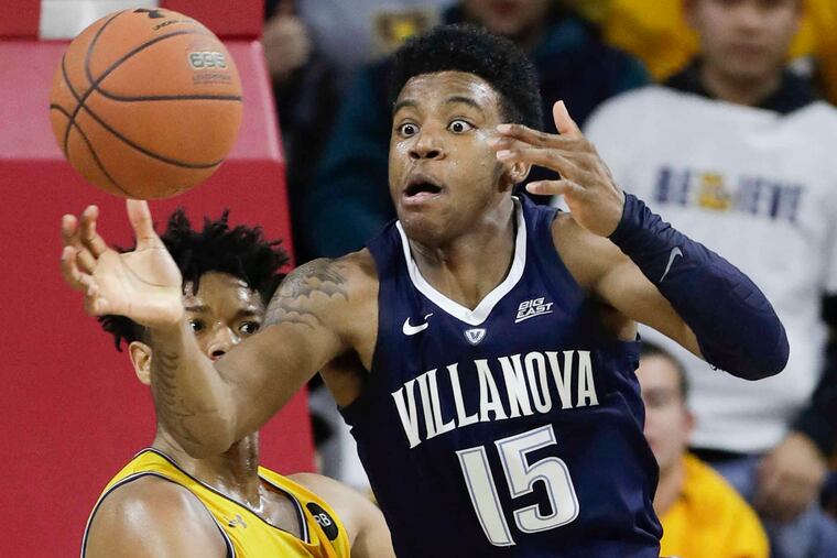 Villanova forward Saddiq Bey steals the basketball during the victory over La Salle.