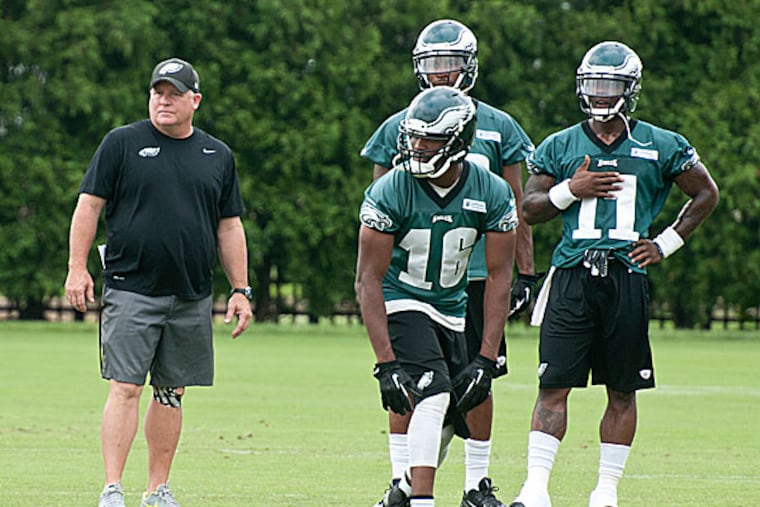 Eagles head coach Chip Kelly watches his wide receivers participate in a drill. (Ron Tarver/Staff Photographer)