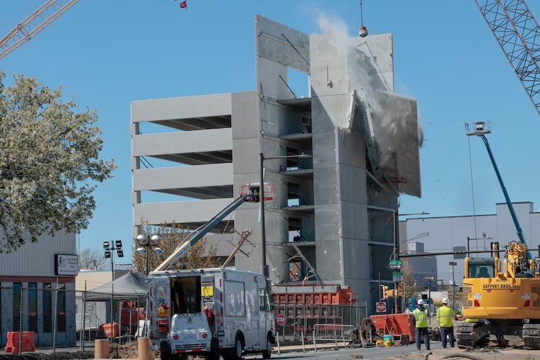 Recovery and demolition operations at the site of the partially collapsed garage in Grays Ferry Saturday, April 11, 2026, in Philadelphia.