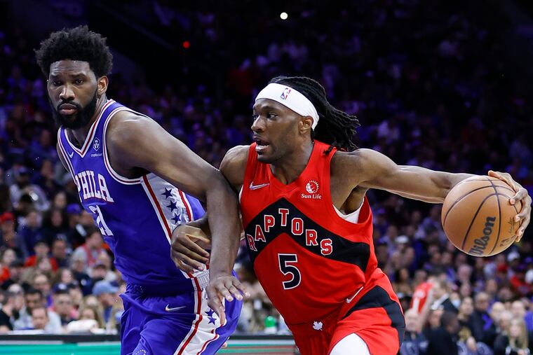 Toronto Raptors forward Precious Achiuwa drives to the basket against Sixers center Joel Embiid during game five of the first-round Eastern Conference playoffs on Monday, April 25, 2022 in Philadelphia.