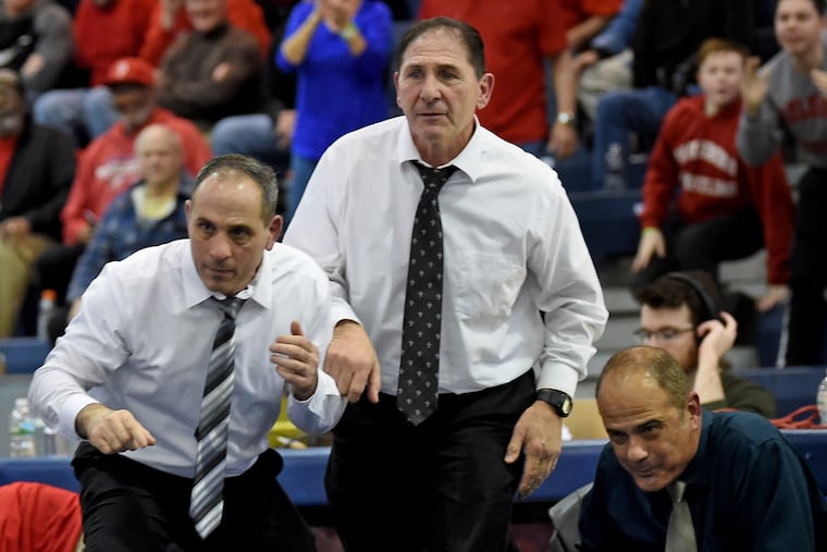Paulsboro wrestling coach Paul Morina (right) watches during a match in 2019. Morina is the majority owner of Hometown International.