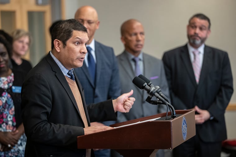 Pennsylvania Deputy Secretary of Education Noe Ortega, left, at a press conference held at the Community College of Philadelphia, Center for Business and Industry, on November 20, 2019.