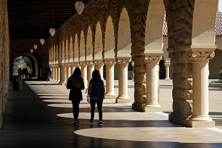 Students walk through the Stanford University campus, March 14, 2019, in Santa Clara, Calif. A federal judge ruled Friday in favor of Stanford's student newspaper in a case involving First Amendment rights.
