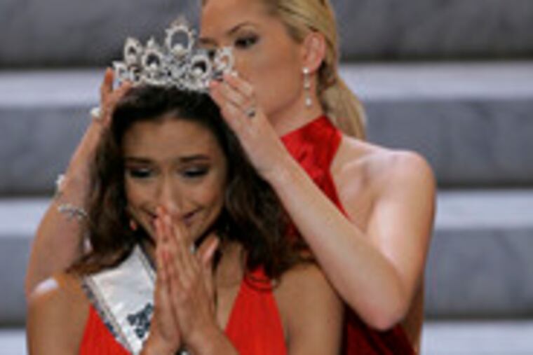 Rachel Smith, 21, of Clarksville, Tenn., is crowned Miss USA by her predecessor, Tara Conner, whose reign was marked by scandal.