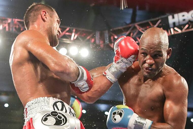 Bernard Hopkins takes a shot to the head by Sergey Kovalev. (Steven M. Falk/Staff Photographer)