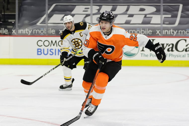 Flyers left winger Oskar Lindblom, shown against Boston on Feb. 5, and Scott Laughton became the sixth and seventh players on the team's COVID-19 list Friday.