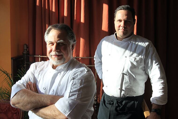 Al Paris, left, chef/proprietor, and Eric Hall, chef de cuisine, are shown by the front window of the Paris Bistro & Jazz Cafe on Jan. 24, 2014. ( CHARLES FOX / Staff Photographer )