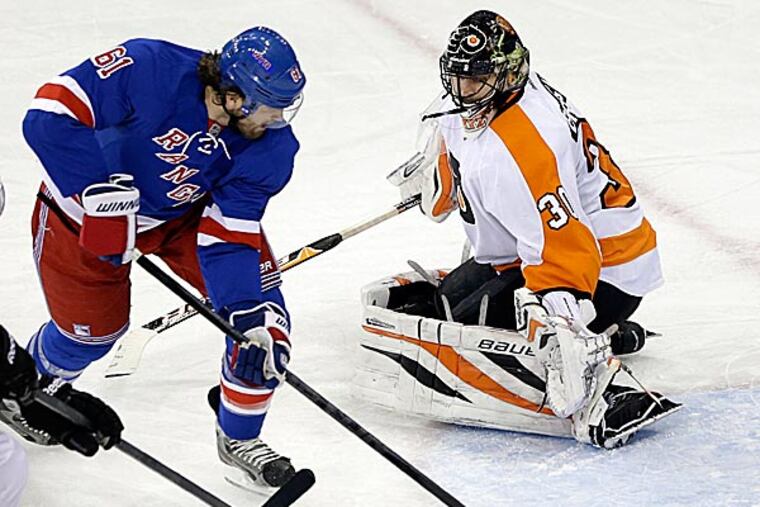 The Rangers' Rick Nash skates past Flyers goalie Ilya Bryzgalov to score a goal during the third period. (Frank Franklin II/AP)