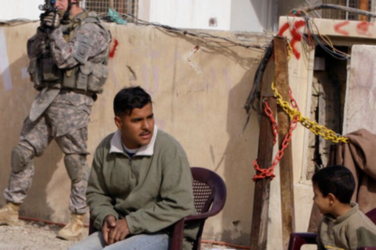 A U.S. soldier in Baghdad. A top U.S. general says troops will stay on to address any violence after January's elections.