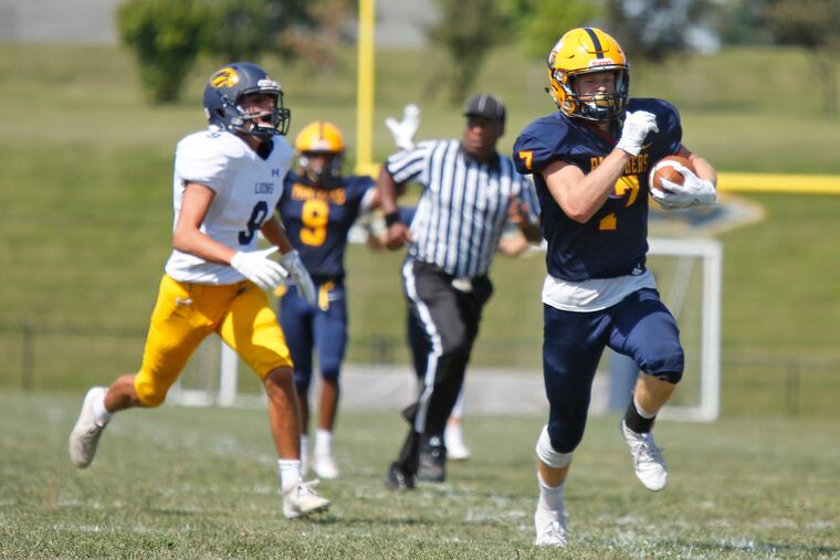 Andrew McDonald of Pope John Paul II races to the end zone on a punt return ahead of New Hope-Solebury defensive back Ryan Sullivan.
The host Golden Panthers went on to beat New Hope-Solebury, 55-6.