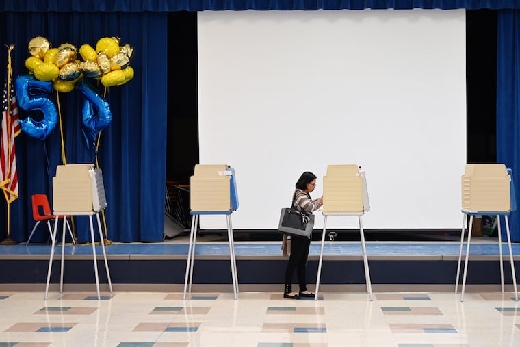 A voter fills out a ballot in Midlothian, Va., in 2024.