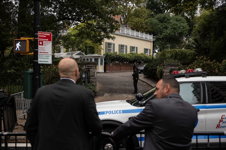 Police officers stand outside Gracie Mansion, the official residence of New York City Mayor Eric Adams, on Thursday, Sep. 26, 2024, in New York.
