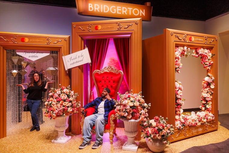 At left is Stephanie Farr and Earl Hopkins in the Bridgeton selfie display, Netflix House, King of Prussia Mall, Tuesday, November 11, 2025.