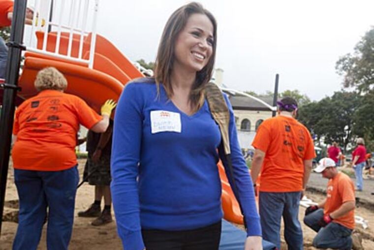 Flyers intern Danielle Maslany reports on the construction of a new playground. (Ryan S. Greenberg/Staff Photographer)