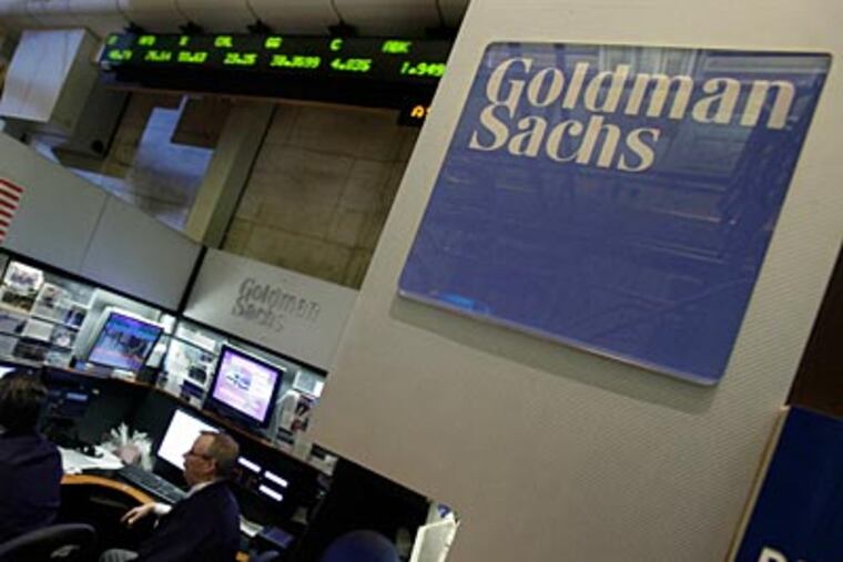 Traders work in the Goldman Sachs booth on the floor of the New York Stock Exchange Monday, April 19, 2010. (AP Photo/Richard Drew)
