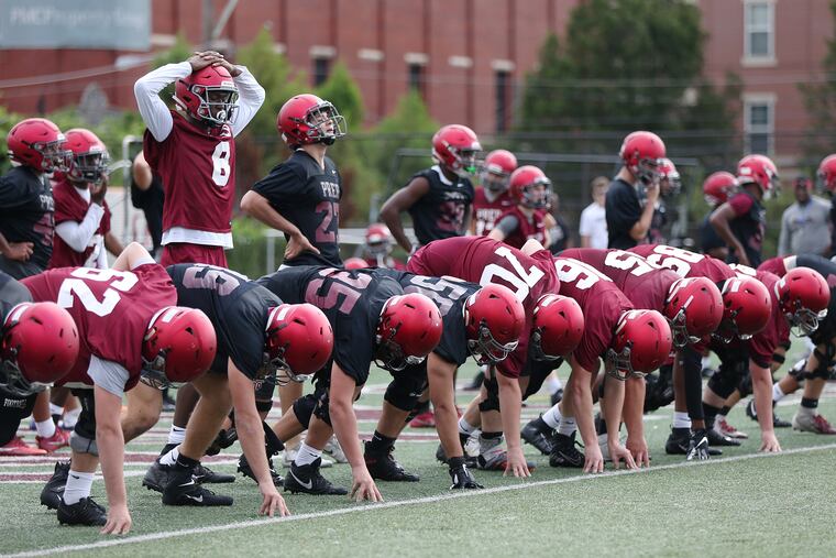 The Prep players run sprints at a recent practice.