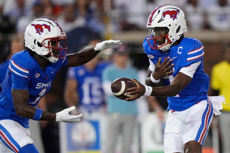 SMU quarterback Kevin Jennings handing off to running back Brashard Smith during a Sept. 28 game against Florida State.
