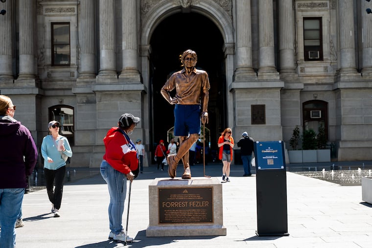 A commemorative statue of a shorts-wearing Forrest Fezler is unveiled by Adidas Golf at City Hall’s Dilworth Park on Tuesday.
