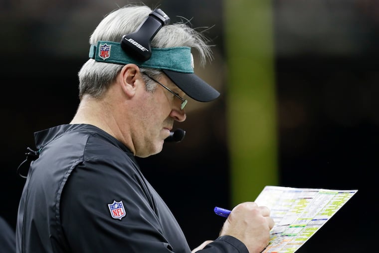 Eagles Head Coach Doug Pederson looking at his play chart against the New Orleans Saints in a NFC Divisional playoff game on Sunday, January 13, 2019 in New Orleans.