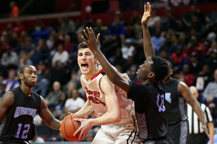 Newark Central's Joel Uzoka-Simmons (10) defends against Haddonfield's Dan Fleming (33) during the Group 2 state championship game on March 11, 2018.