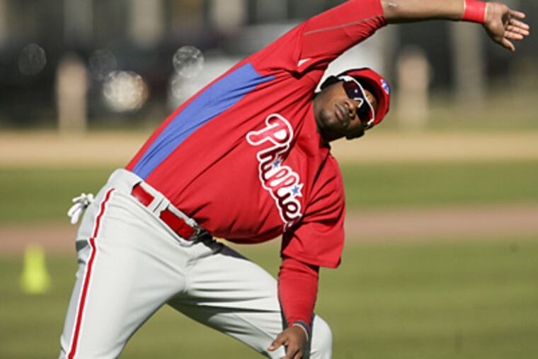 Phillies' minor leaguer Domonic Brown stretches during spring training workouts at Bright House Field. (Yong Kim / Staff Photographer)