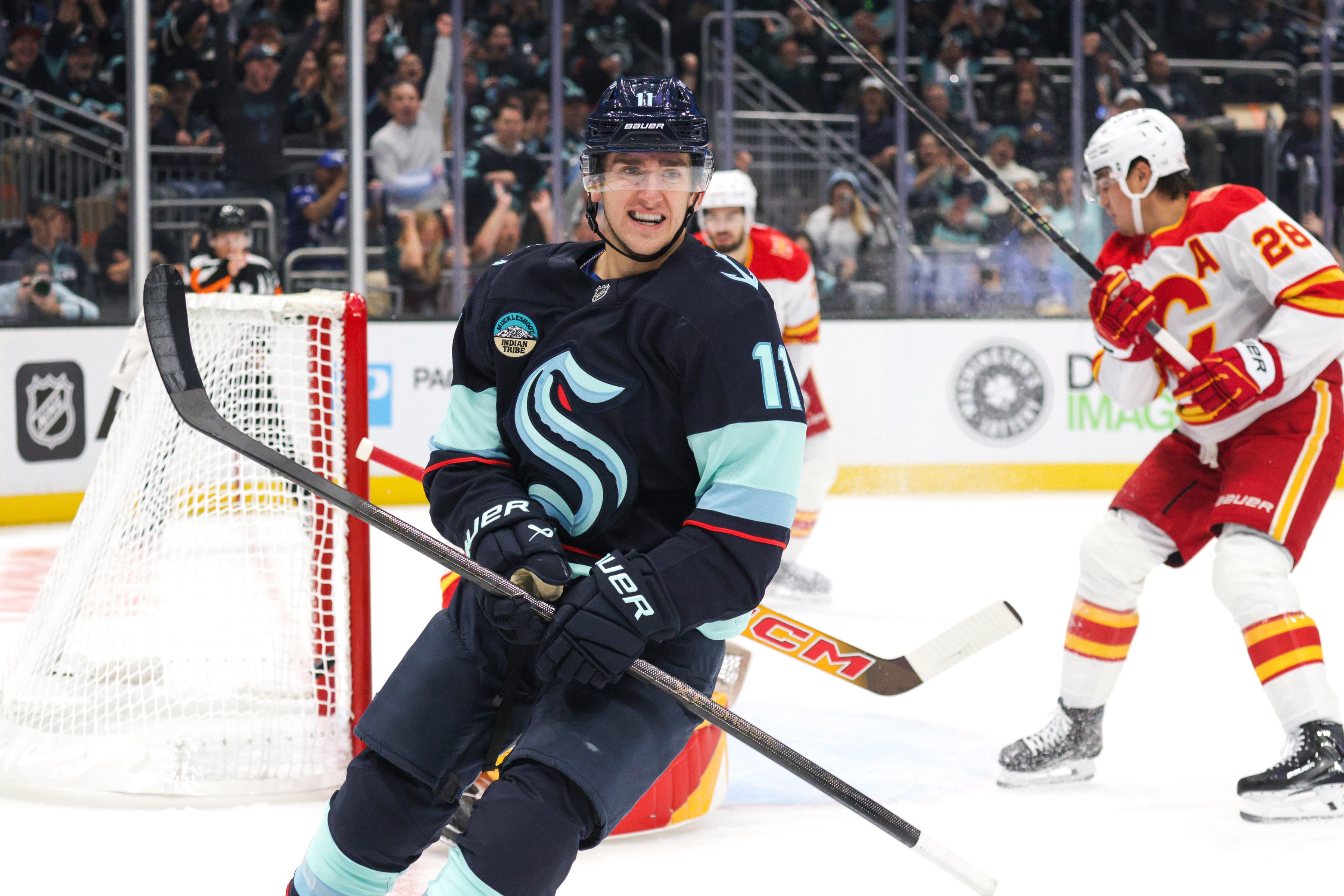 Samoskevich scores twice and Kraken beat Flames 6-1 in home opener as Calgary stays winless