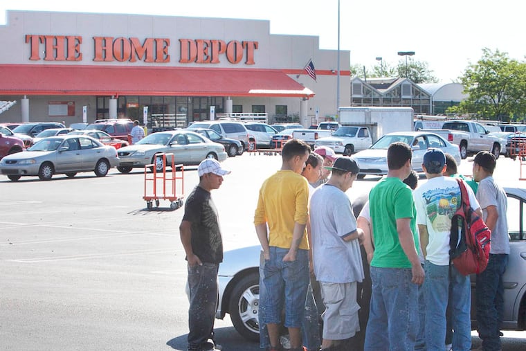 A group of day laborers solicit work from potential client in parking lot of Home Depot. Philaposh, Philadelphia Area Project on Occupational Safety and Health, met with day laborers at Home Depot on Roosevelt Blvd in northeast Philadelphia on Thursday, August 14, 2014. ( ALEJANDRO A. ALVAREZ / STAFF PHOTOGRAPHER )