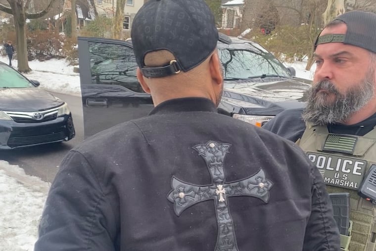 U.S. Marshals and police arrested Michael Robinson, a 43-year-old paraprofessional at Radnor Middle School, Thursday morning in Wayne.