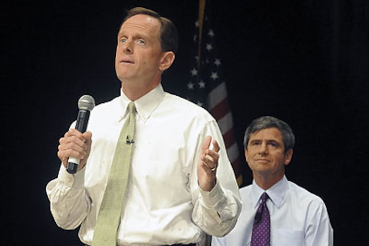 About 400 people politely packed a room at Muhlenberg College Wednesday night to hear Pat Toomey and Joe Sestak talk about health care reform. (Kevin Mingora/Allentown Morning Call/AP)