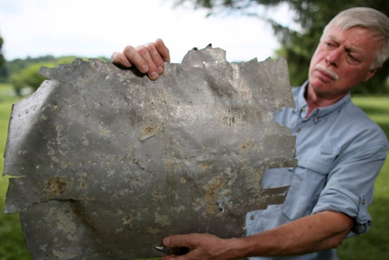 Could this aluminum panel, found on a remote Pacific island, have replaced a rear window on Amelia Earhart's Lockheed Electra? Ric Gillespie, leader of TIGHAR, a group striving to solve her disappearance, says new evidence suggests the chances are highly likely. (JOSEPH KACZMAREK / Courtesy of TIGHAR)