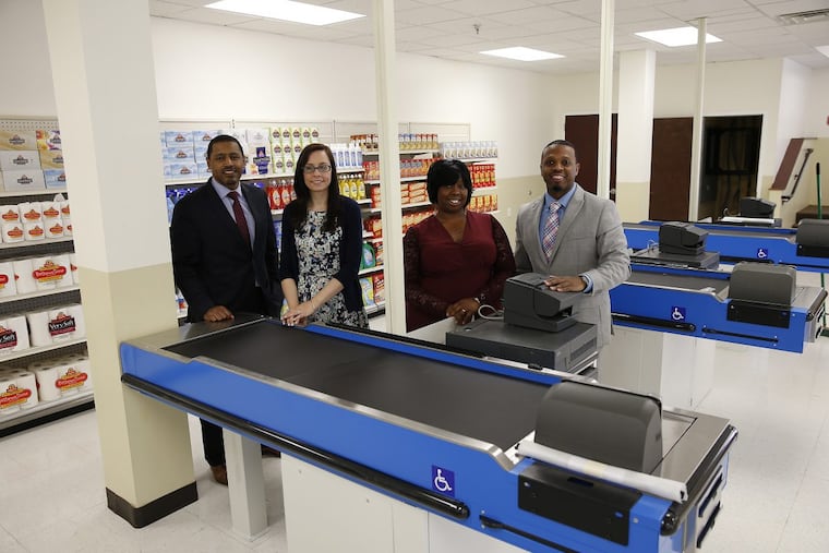 Enon Baptist Tabernacle Church will house a job-training program to teach people who have been in prison how to become supermarket cashiers. Graduates will get jobs at Brown’s SuperStores, a chain of 13 ShopRite and Fresh Grocer stores. Left to right: Atif Bostic, head of UpLift Solutions, the nonprofit developing the program, social worker Lauren Ruday, chief instructor Monique Oakman, and Barry Johnson, program director, line up in the classroom at Enon. DAVID MAIALETTI / Staff Photographer