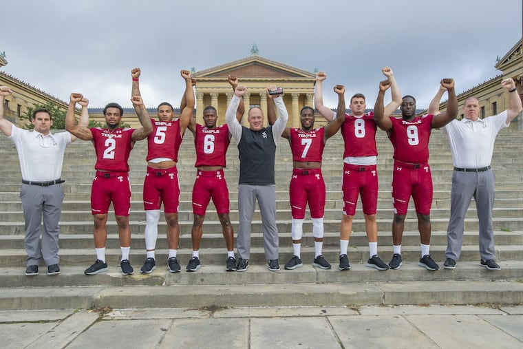 OWLSFB03-f.Single digit members of the Temple University Football Team and their coaches pose for a photograph on the steps of The Philadelphia Museum of Art on August 2, 2018. From left are David Feely, Head Strength and Conditioning Coach, Delvon Randall, 2 Shaun Bradley, 5, Rock Ya-Sin, 6, Geoff Collins, Head Football Coach, Ryquell Armstead, 7, Frank Nutile, 8, Michael Dogbe, 9 and Ryan Horton Assistant Strength and Conditioning Coach. (Jonathan Wilson / For the Inquirer)