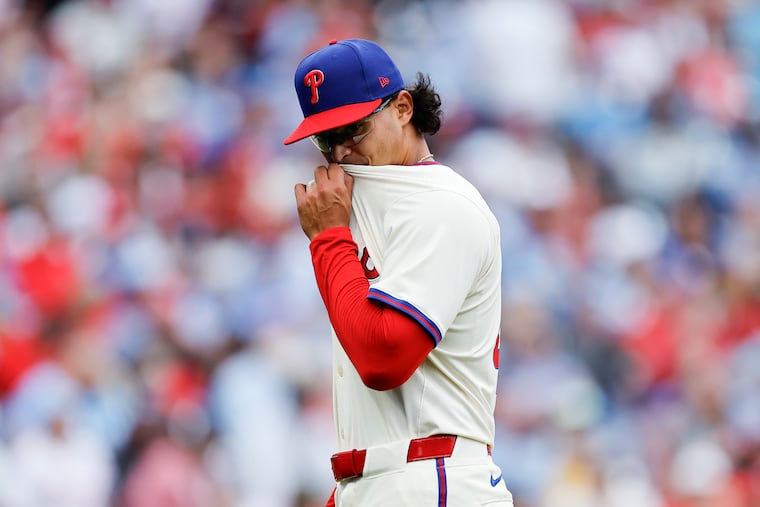 Phillies pitcher Jesus Luzardo wipes his face after leaving the field after in the fourth inning against the Milwaukee Brewers.