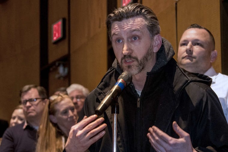 Abington High School alum Dave Brooks speaks at the Abington school board meeting on Tuesday night.